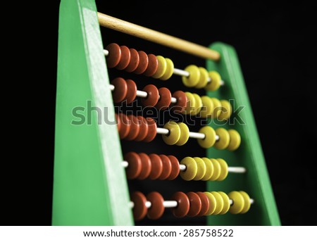 Photography of colorful abacus on black background