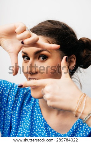 girl making hand frame