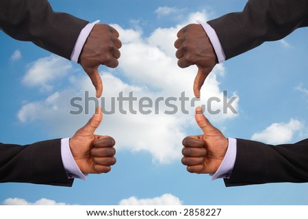 This is an image some hands competing against each other with a sky in the background.This image can be used to represent the theme "Team Decisions"