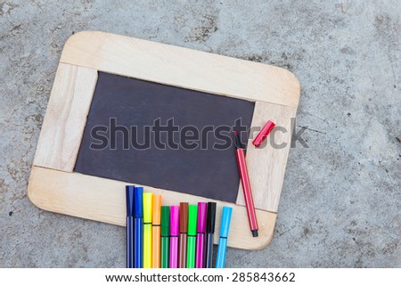 blank vintage slate blackboard and pen