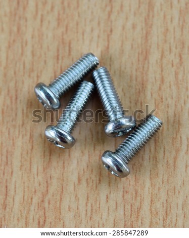four bolts-screws on the wood 
