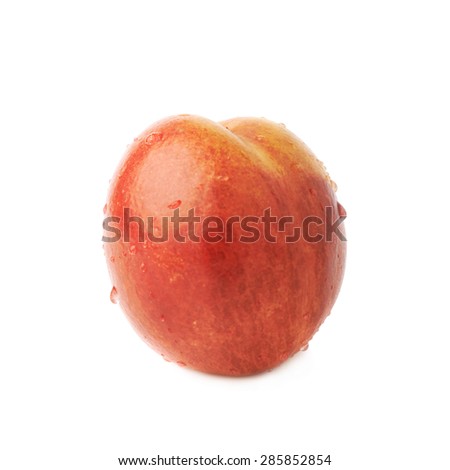 Single ripe nectarine covered with water drops, isolated over the white background