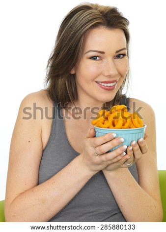 Attractive Happy Young Woman Holding a Bowl of Onion Ring Flavoured Snacks