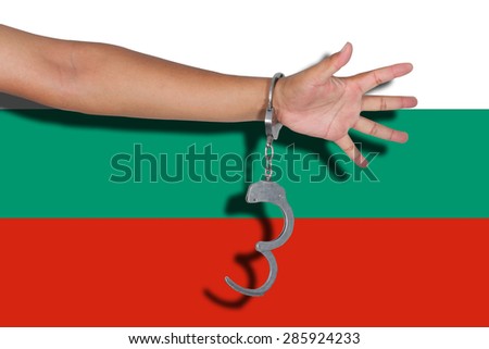 handcuffs with hand on Bulgaria flag