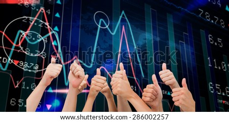 Group of hands giving thumbs up against stocks and shares