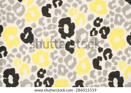 Black, grey and yellow leopard pattern. Black and white with bright yellow spotted animal print as background.