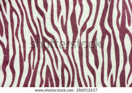 Red and white zebra pattern. Brown animal print as background.