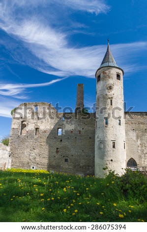 Medieval castle under blue cloudy sky
