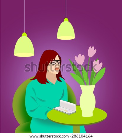  Young girl sitting by the table with a vase of flowers and reading.
