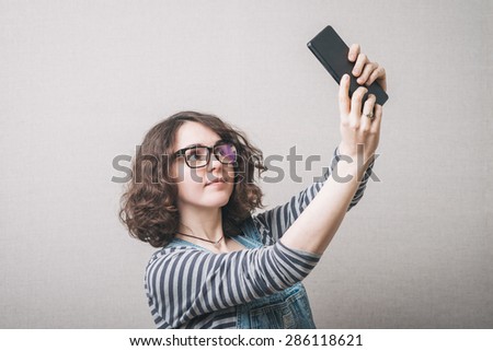 Modern technologies leisure and lifestyle concept. Young woman casual style girl with computer tablet taking self photo 