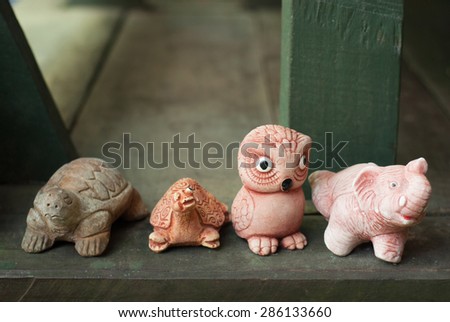 Clay sculptures turtle, owl and elephant 