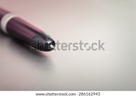 pen and graphics tablet close up.focus on the web , the background is blurred. tinted photo for background. free space for text