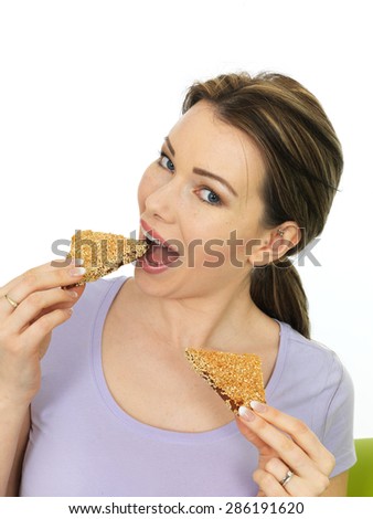 Attractive  Happy Smiling Young Woman Holding Slices of Sesame Toast