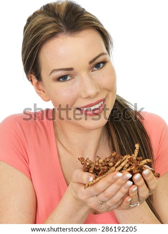 Attractive Happy Young woman Holding A Handful Of Savory Twigglets