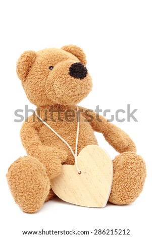 Conceptual image of teddy bear with heart symbol isolated