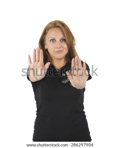 Woman doing a stop gesture with her both hands against a white background