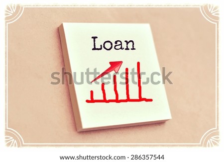 Text loan on the graph goes up on the short note texture background