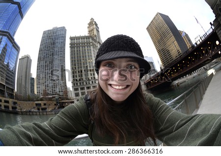 Teen teenager tourist girl taking selfie with camera in Chicago 