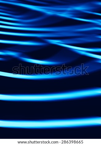 Vertical vibrant blue ocean waves blur abstraction background backdrop
