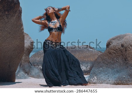 Tribal style woman on the beach