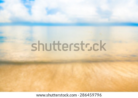 blur image of sea shore and clear blue sky  for background usage .