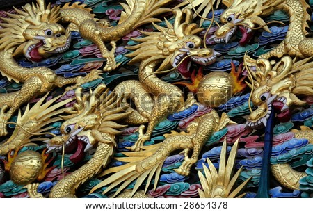 dragons on the wall of an ancient temple in China
