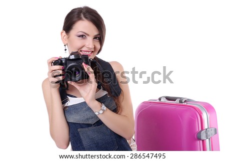 Young female photographer with camera in isolated on white background.