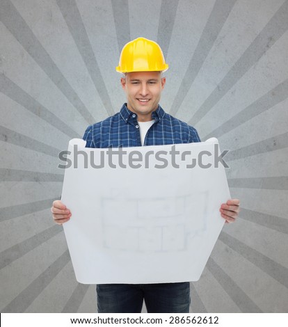 repair, construction, building, people and maintenance concept - smiling male builder or manual worker in helmet with blueprint over gray burst rays background