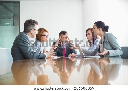 Businesspeople arguing in meeting Royalty-Free Stock Photo #286606859
