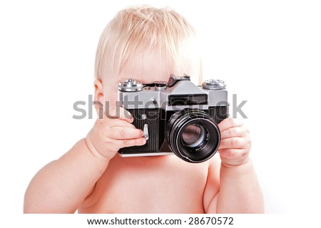 Bright picture of baby boy holding photo camera isolated on white background