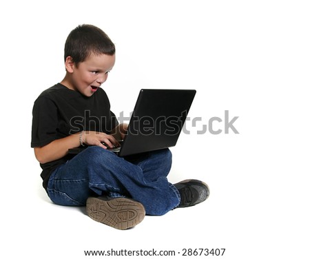 Excited Young Child Working on Computer