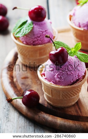 Cherry ice-cream with mint, selective focus