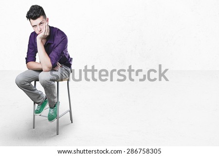 bored worker on little chair.