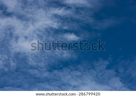 white fluffy clouds in the blue sky, background