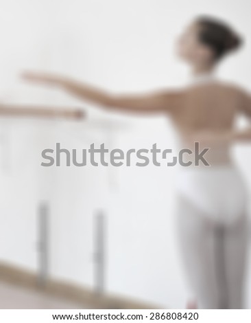 Portrait of the ballerina in ballet pose blurred