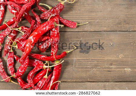 Spicy red pepper on a wooden table to make a sauce