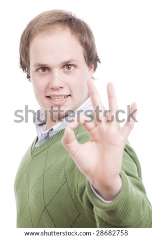 Young casual man signaling Ok - focus on eyes