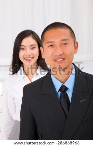 Close-up of smiling businesspeople