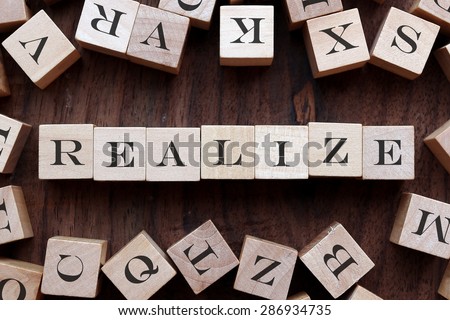 text of REALIZE on cubes