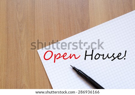 White blank notepad on office wooden table Open house concept