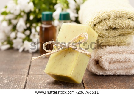 Photo of olive soap over wooden table