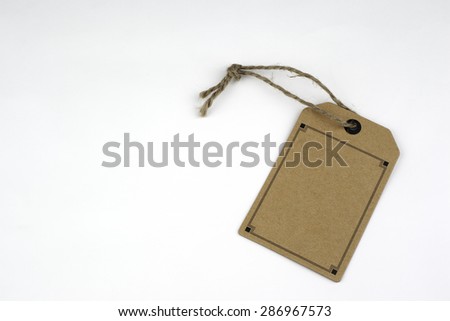 Cardboard price tags with string on a white background.