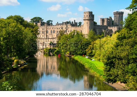 Warwick castle from outside. It is a medieval castle built in 11th century and a major touristic attraction in UK nowadays. Sunny day Royalty-Free Stock Photo #287046704