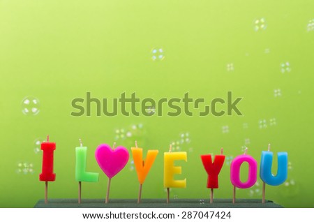 Text I love you on a green background and the bubble component.