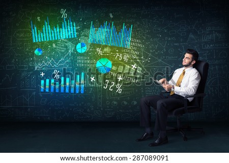 Businessman in office chair with tablet in hand and high tech graph charts concept on background
