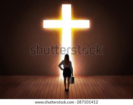 Woman looking at bright cross sign concept