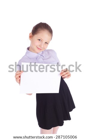 pretty little school girl holding blank sheet of paper