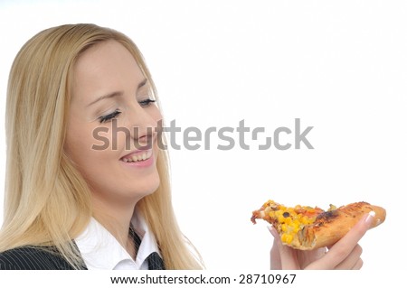 Young cheerful business woman looking on pizza slice