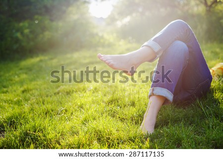 Relaxing in a meadow in the summer sun Royalty-Free Stock Photo #287117135