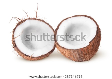Two halves of coconut lying next isolated on white background